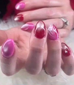 Showanda's recent work: pink chrome nails with swirling accents